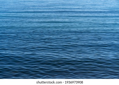 Calm blue sea waves background wallpaper
