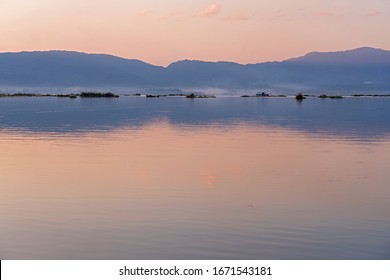 A calm dusk on the Loktak lake in Manipur, India. - Shutterstock ID 1671543181