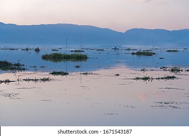 A calm dusk on the Loktak lake in Manipur, India. - Shutterstock ID 1671543187