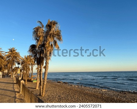 Calm evening sunset along the promenade and beach. Marbella, Spain. November 24th 2023