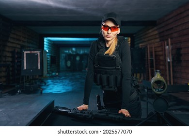 Calm Female Sniper In A Bulletproof Vest Looking Ahead