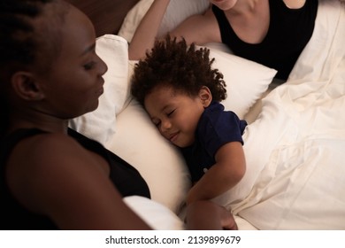 Calm Happy Little Boy Sleeping In Bed Of His Parents, Co-sleeping And Bed Time Routine Concept