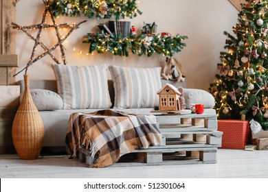 Calm Image Of Interior Modern Home Living Room Decorated Christmas Tree And Gifts, Sofa, Table Covered With Blanket.