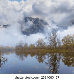 calm lake in misty mountain valley  - Powered by Shutterstock