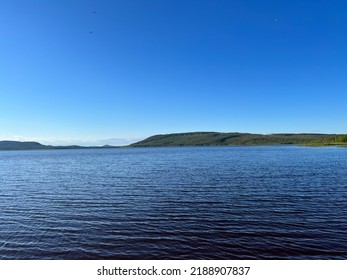 Calm Lake View In The Forest, Blue Sky