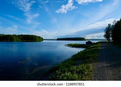 Calm Lake View In The Forest, Blue Sky