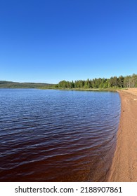 Calm Lake View In The Forest, Blue Sky