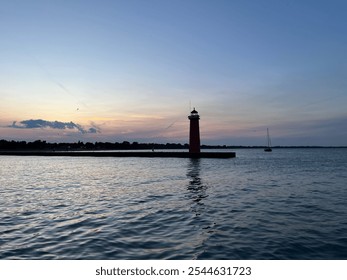 Calm lakeside, sunset, glowing sky, orange, pink, lavender, gentle waves, birds, flying, lighthouse, light beam, water reflection, dreamy atmosphere. - Powered by Shutterstock