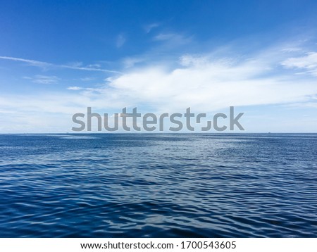 Calm marine landscape seawater under blue sky