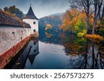 Calm morning scene of Totzenbach Castle on the shore of small pond. Dramatic autumn cityscape of Totzenbach town, district of Sankt Polten-Land in the Austrian state of Lower Austria, Europe.