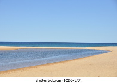 A Calm Ocean Meets An Equally Calm Lagoon