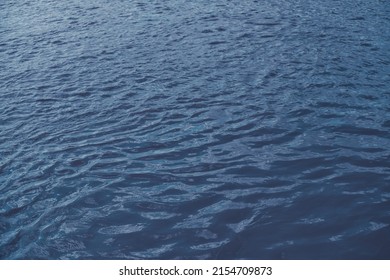 Calm Ripple On Water Surface. River, Lake, Pond, Sea Pure Blue Water.