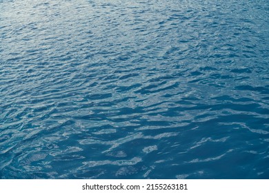 Calm Ripple On Water Surface. River, Lake, Pond, Sea Pure Blue Water.