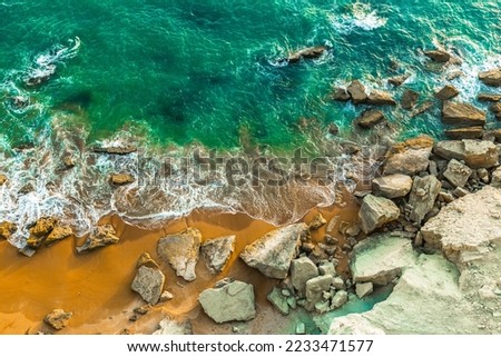 The calm sea and the rocky coast of the Oman Sea. Amazing view on the beautiful beach of Chabahar, Iran.