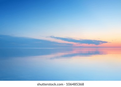 Calm Sea And Sky During Sundown. Bright Seascape Background