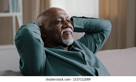 Calm serene elderly adult African American man relaxing with eyes closed take break relax at home office, old grandpa enjoying rest feel peace Dominican senior businessman napping on comfortable couch - Powered by Shutterstock