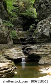 Calm And Steady Stream Of Water Carving The Rock