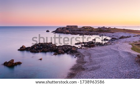 A calm sunrise overlooking Fort Le Marchant and shooting range in Guernsey