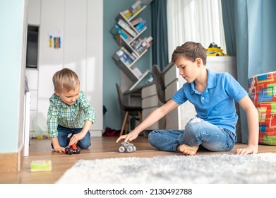 Calm Teenager Playing With His Younger Sibling