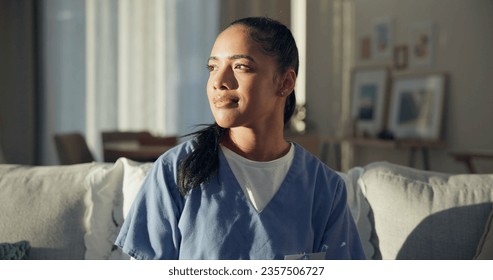 Calm, thinking and a nurse or woman on the sofa to relax from a career in healthcare in a house. Smile, peace and a medical employee or doctor with an idea or vision on the couch for a memory - Powered by Shutterstock