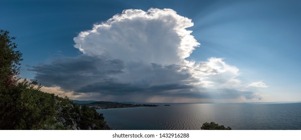 Calm Tropical Sea Under Darkening Storm Storm Clouds On The Horizon