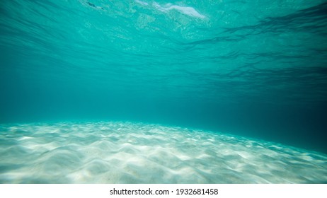 Calm, turquoise clear water for swimming and snorkeling underwater at a Hawaii beach 