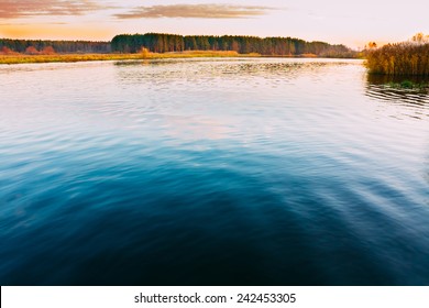 Calm Water Of Lake, River, Forest On Other Side. Landscape. Russian Nature Background.