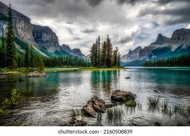 Calm water of a mountain lake. Lake in mountains. Beautiful mountain lake landscape. Mountain lake view