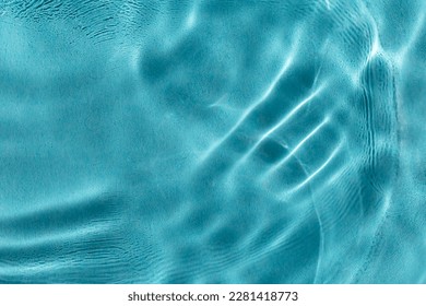 Calm water in pool with sunlight. The concept of peace and relaxation. Close-up, selective focusing, defocusing - Powered by Shutterstock