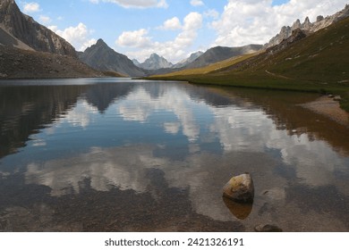 The calm waters of Lake Orrenaye reflect the Bec du lièvre and the Meyna (Ubaye valley, Mercantour, Alpes de Haute Provence, France)