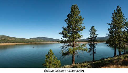 Calm Waters Of A Northern California Reservoir Un The Sierra Nevada Mountains.