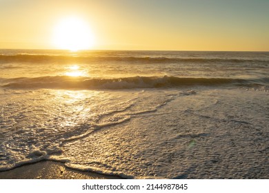 Calm Waves On Shore At Beach Against Sky During Sunset. Unaltered, Nature, Horizon And Summer Concept.