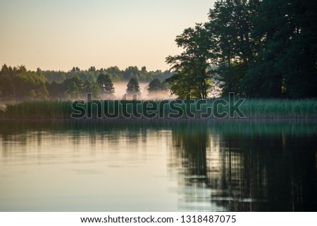 Similar – Trees and Reflection Calm