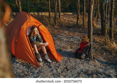 Calm Woman Inside Tent Is Admiring Sunset