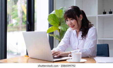 Calm woman relaxing  with laptop, no stress free relief at library concept.