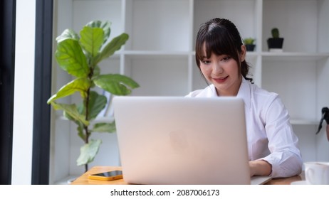 Calm woman relaxing  with laptop, no stress free relief at library concept.