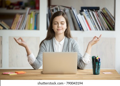 Calm woman relaxing meditating with laptop, no stress free relief at work concept, mindful peaceful young businesswoman or student practicing breathing yoga exercises at workplace, office meditation