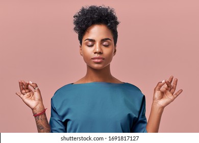 Calm woman relaxing meditating, no stress free relief at work concept, mindful peaceful young businesswoman or doctor practicing breathing yoga exercises on isolated over beige background