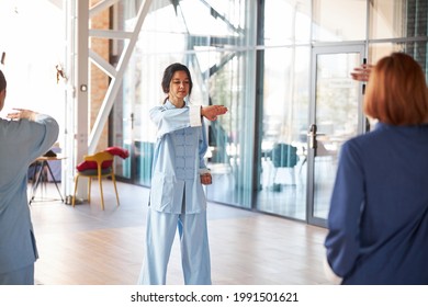 Calm Women Making Movements At Their Tai Chi Class