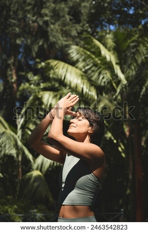 Similar – Brunette surfer woman in bikini standing with surfboard