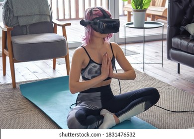 Calm Young Woman Pink Hair Wear Vr Glasses Sportswear Meditating At Home. Fit Sporty Lady Doing Yoga Training Fitness Exercise Feel No Stress Free Zen Future Digital Virtual Reality Experience.