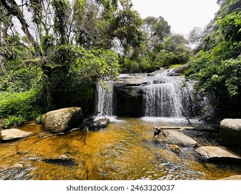 Calming escape: soothing sound of a gentle waterfall  - Powered by Shutterstock