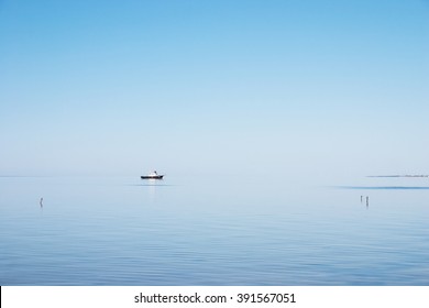 Calmness
Small boat in the morning calm sea