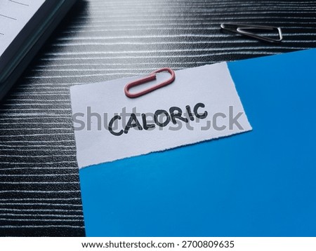 Caloric writting on table background.