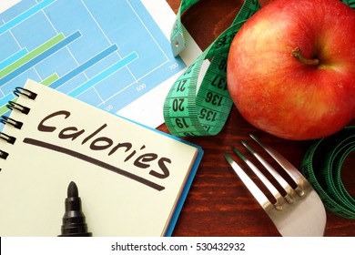 Calories written in a diary. Calorie counting concept. - Shutterstock ID 530432932