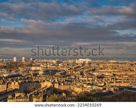 From Calton Hill, a view across the City of Edinburgh to Leith and the Firth of Forth. Taken in winter sunshine.