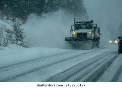 Caltrans snowplows work to clear snow off U.S. 395 in Mono County during the latest winter storm in the Sierra Nevada of California.