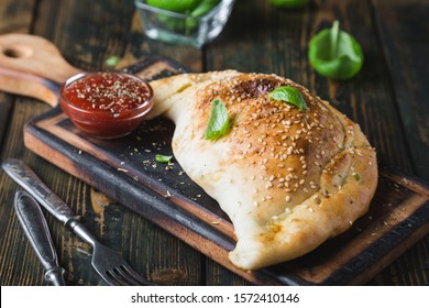Calzone pizza with chicken and cheese