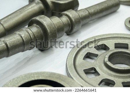 The cam shaft material from casting process. The automotive parts manufacturing process by casting process.