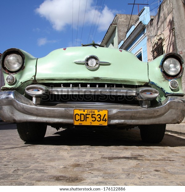CAMAGUEY, CUBA - FEBRUARY 17, 2011:\
Vintage Oldsmobile car parked in Camaguey. Cuba has one of the\
lowest car-per-capita rates (38 per 1000 people in\
2008).